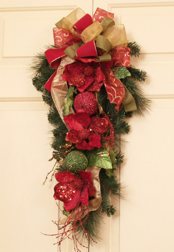Christmas Magnolia and Fruit Swag with Bow 